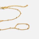 Kaya - 18K Gold Hand Chain Bracelet — made with care and attention to detail. Kaya - 18K Gold Hand Chain Bracelet — made with care and attention to detail.