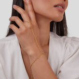 Kaya - 18K Gold Hand Chain Bracelet — made with care and attention to detail. Kaya - 18K Gold Hand Chain Bracelet — made with care and attention to detail.