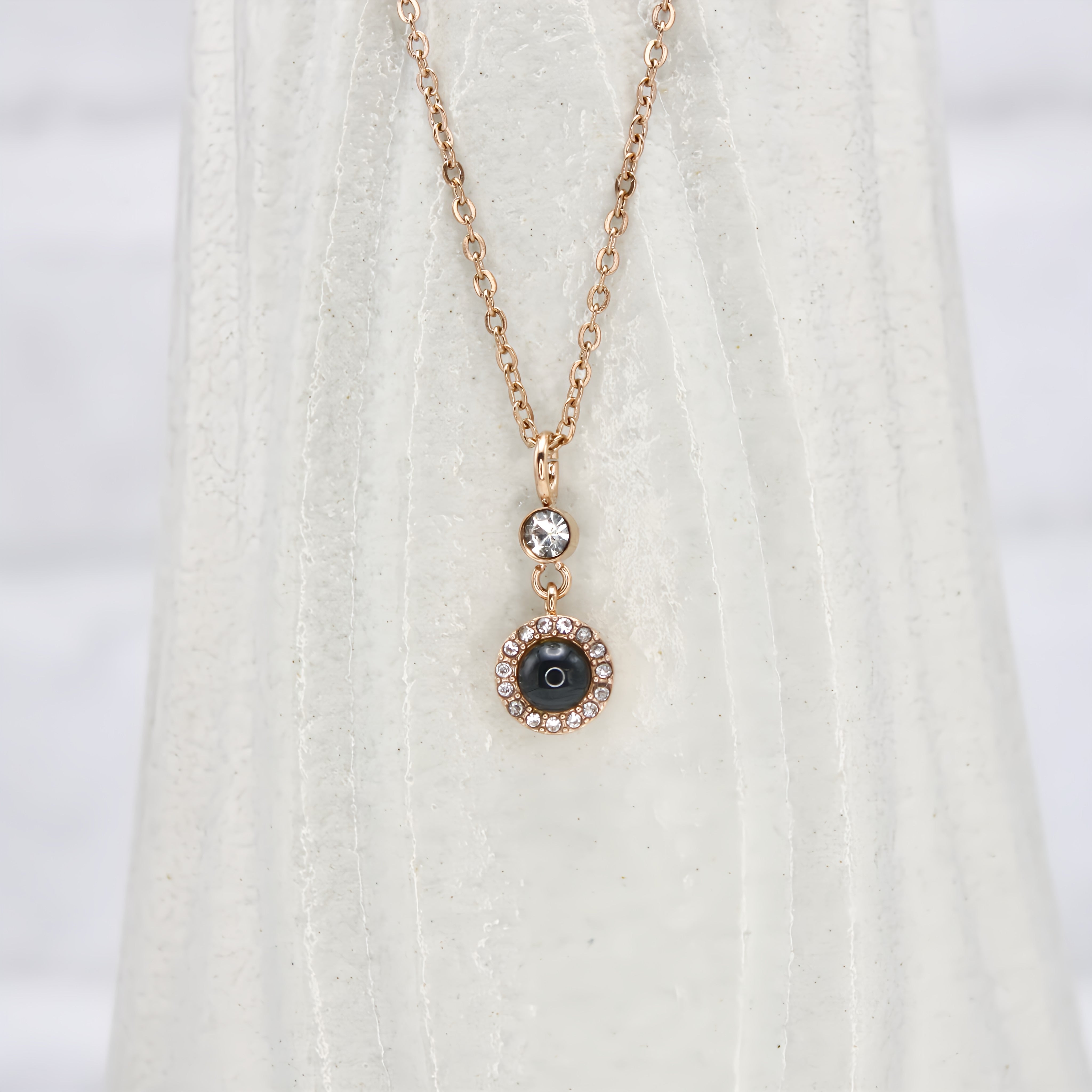 Globe Projection Charm Necklace — made with care and attention to detail. Globe Projection Charm Necklace — made with care and attention to detail.