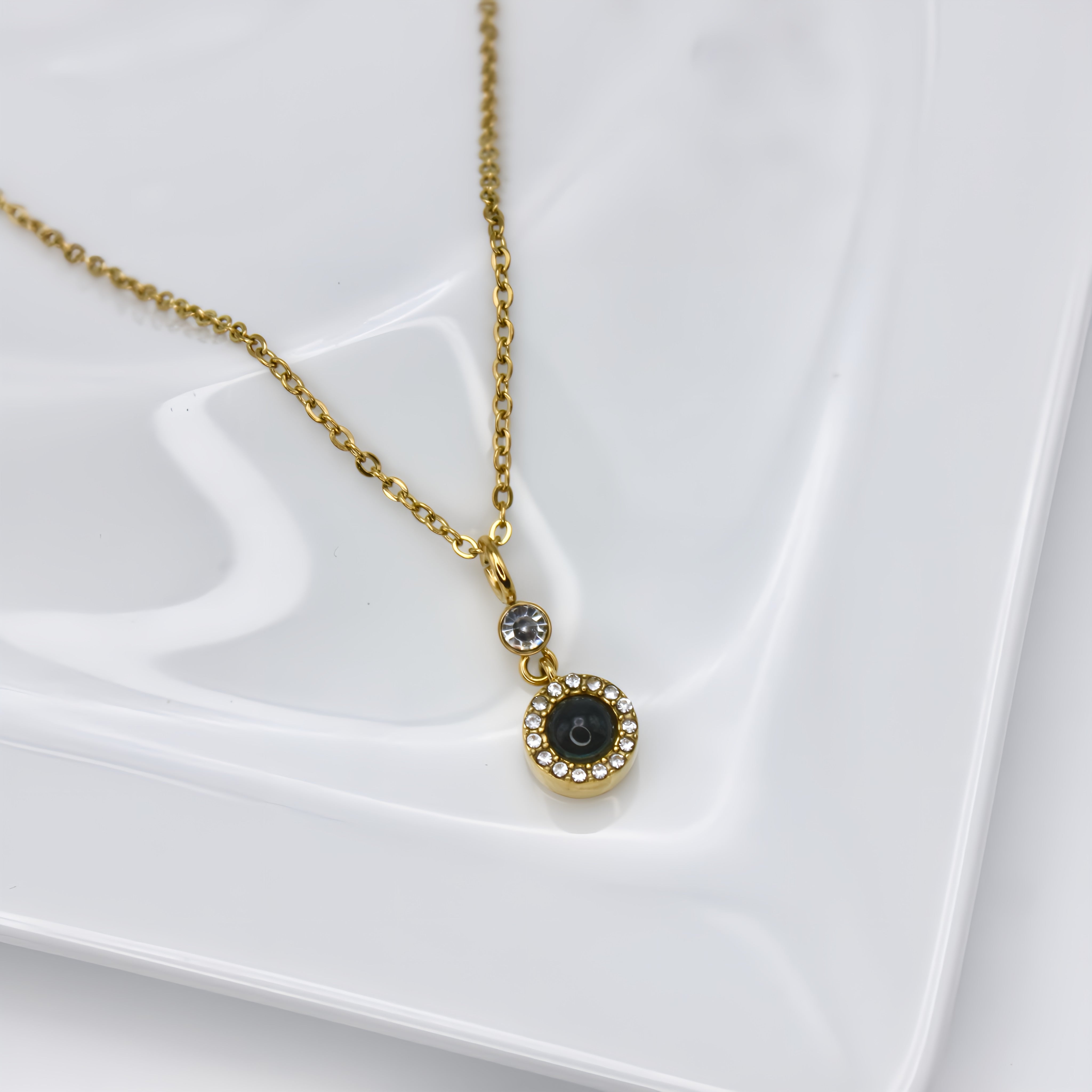 Globe Projection Charm Necklace — made with care and attention to detail. Globe Projection Charm Necklace — made with care and attention to detail.