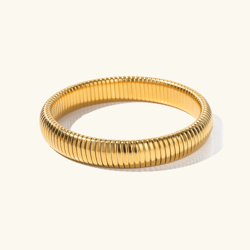 Daphne - Coil Bangle — bringing modern charm to your space. Daphne - Coil Bangle — bringing modern charm to your space.