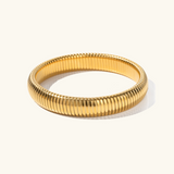 Daphne - Coil Bangle — bringing modern charm to your space. Daphne - Coil Bangle — bringing modern charm to your space.