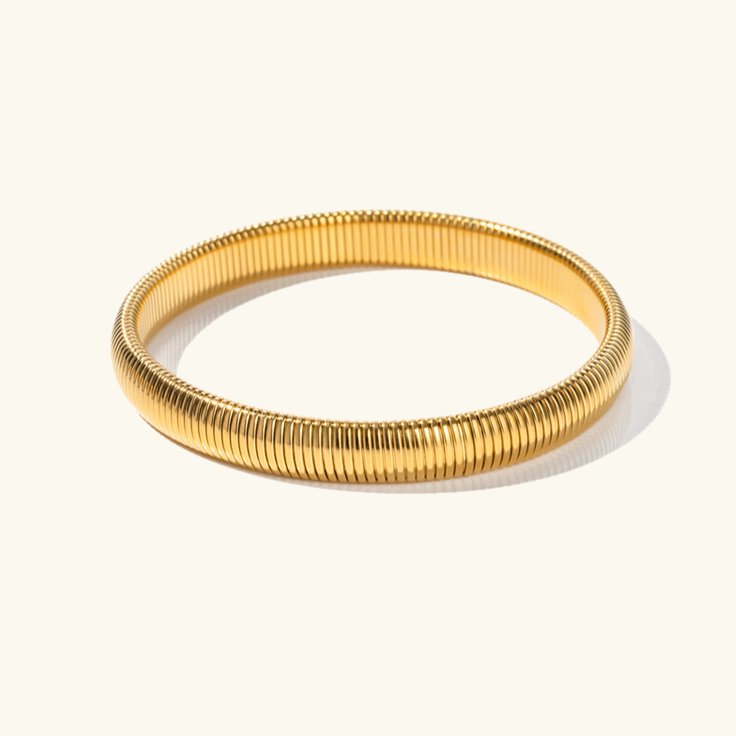 Daphne - Coil Bangle — bringing modern charm to your space. Daphne - Coil Bangle — bringing modern charm to your space.