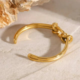 Naomi - Gold Knot Bangle — perfect for those who value comfort and design. Naomi - Gold Knot Bangle — perfect for those who value comfort and design.
