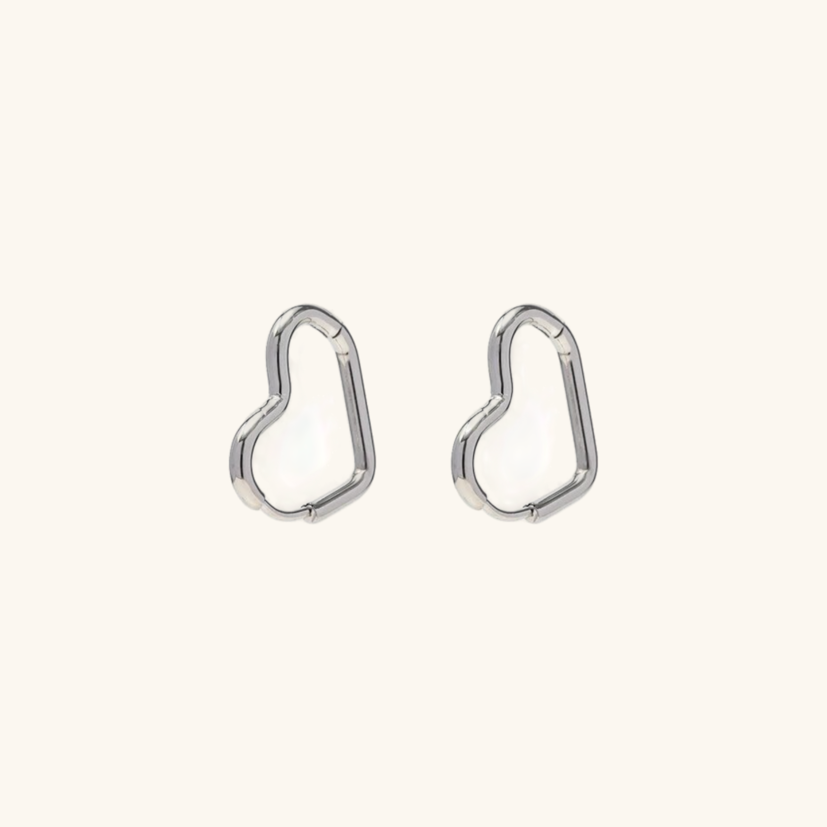 Clarissa - Heart Hoop Earrings — bringing modern charm to your space. Clarissa - Heart Hoop Earrings — bringing modern charm to your space.