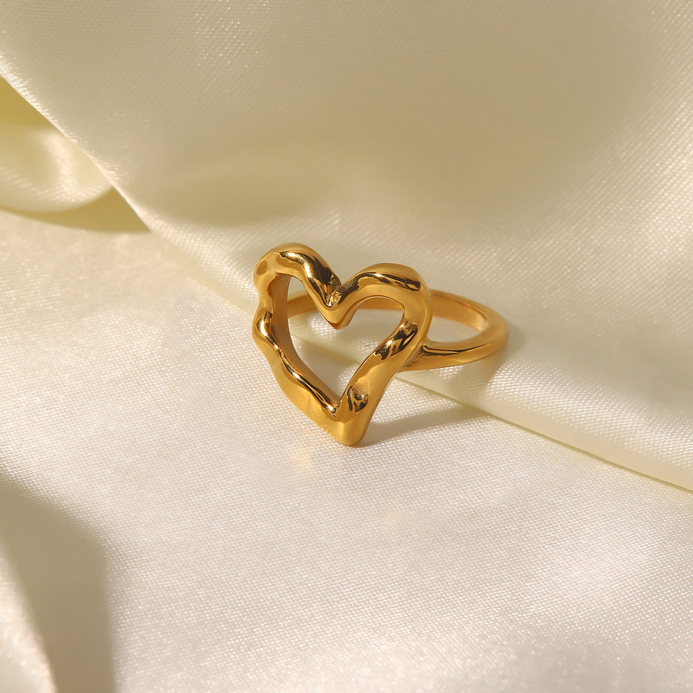 Nalini - Hollow Heart Ring — bringing modern charm to your space. Nalini - Hollow Heart Ring — bringing modern charm to your space.