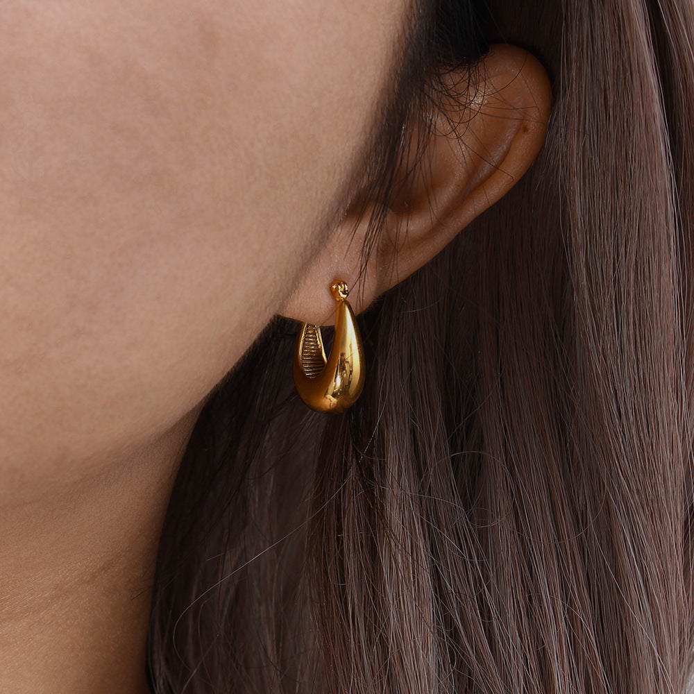 Evie - Gold Hoop Earrings — made with care and attention to detail. Evie - Gold Hoop Earrings — made with care and attention to detail.