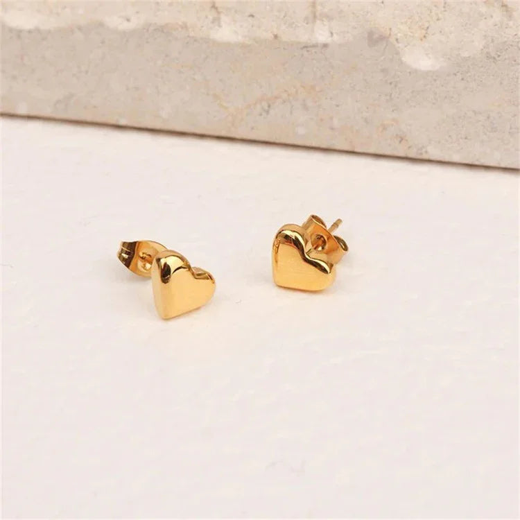 Tegan - Heart Earrings — bringing modern charm to your space. Tegan - Heart Earrings — bringing modern charm to your space.