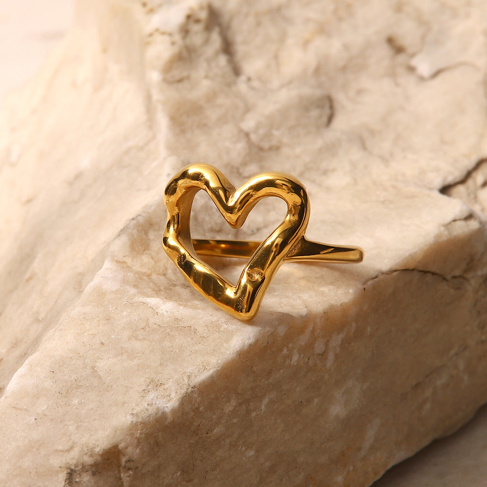 Nalini - Hollow Heart Ring — bringing modern charm to your space. Nalini - Hollow Heart Ring — bringing modern charm to your space.