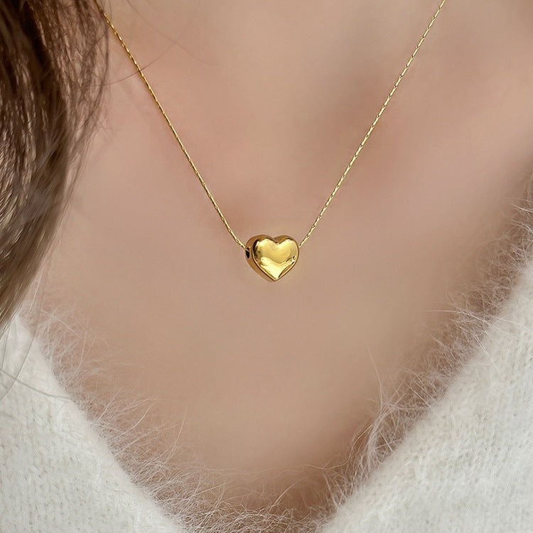 Irene - Gold Heart Necklace — bringing modern charm to your space. Irene - Gold Heart Necklace — bringing modern charm to your space.