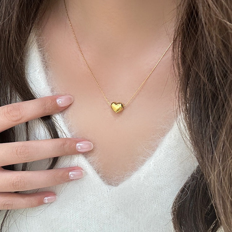 Irene - Gold Heart Necklace — bringing modern charm to your space. Irene - Gold Heart Necklace — bringing modern charm to your space.