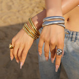 Daphne - Coil Bangle — bringing modern charm to your space. Daphne - Coil Bangle — bringing modern charm to your space.