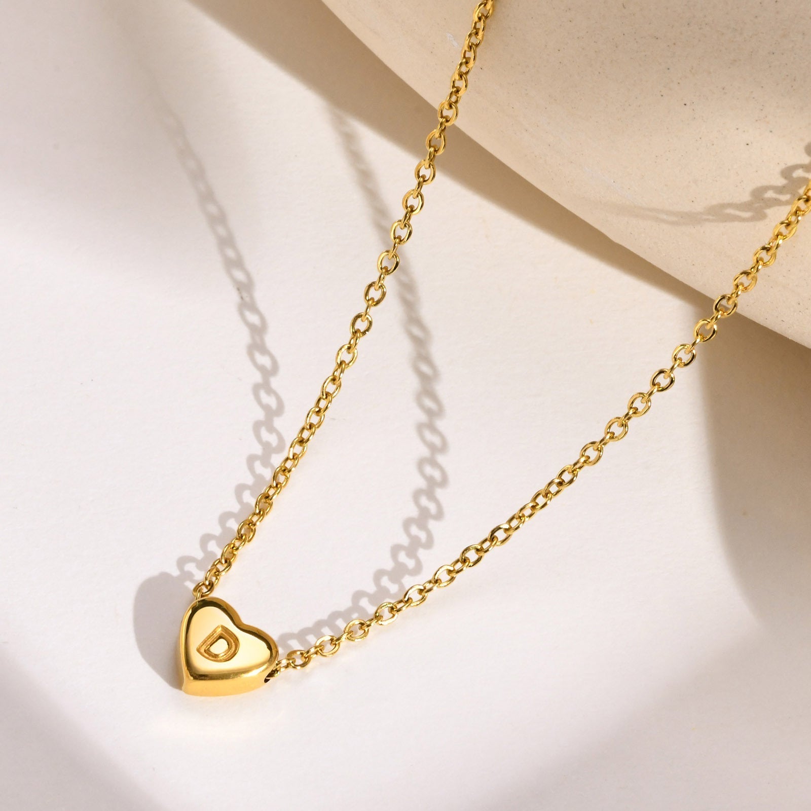 Juliette - Heart Initial Gold Necklace — crafted for everyday quality. Juliette - Heart Initial Gold Necklace — crafted for everyday quality.
