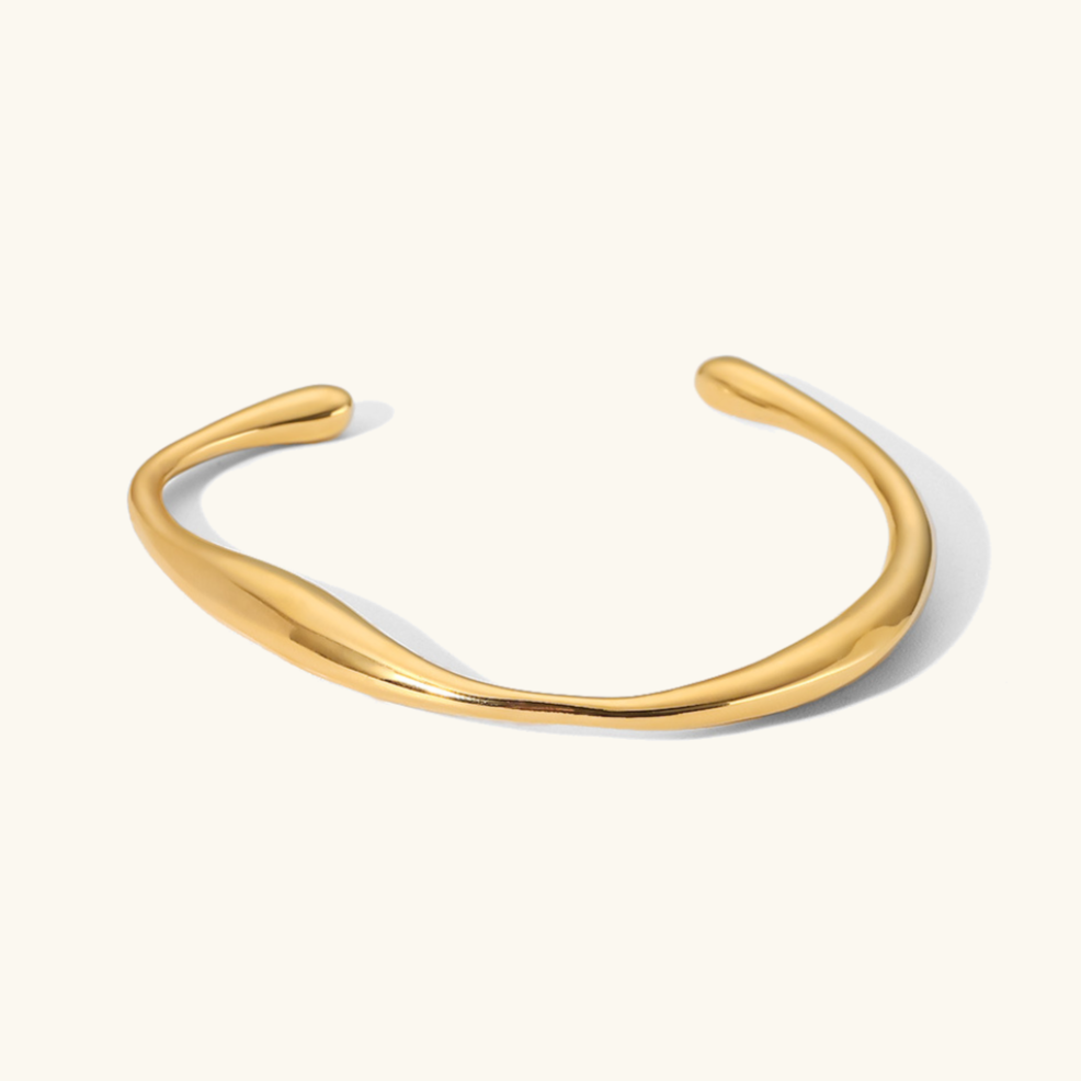 Kennedy - Curved Gold Bangle — perfect for those who value comfort and design. Kennedy - Curved Gold Bangle — perfect for those who value comfort and design.