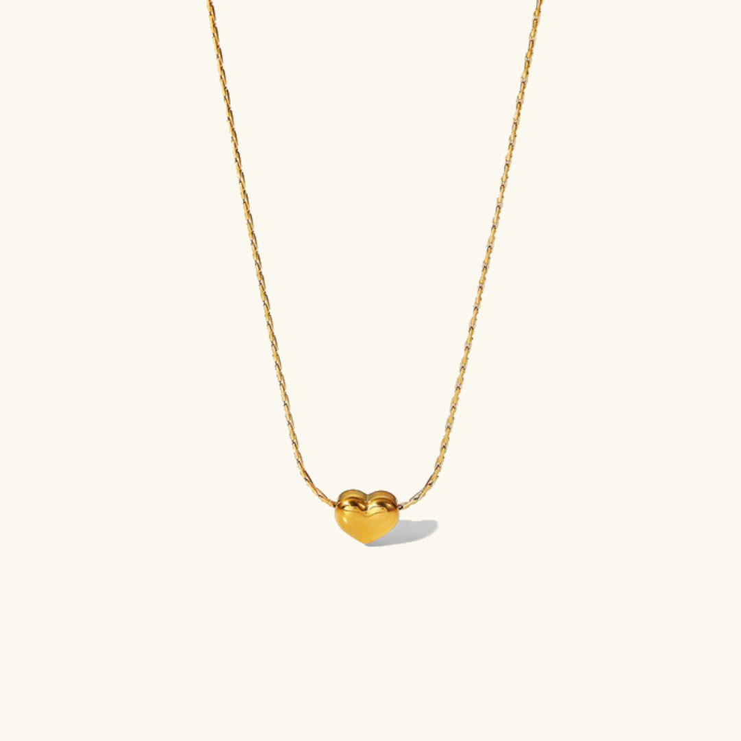 Irene - Gold Heart Necklace — bringing modern charm to your space. Irene - Gold Heart Necklace — bringing modern charm to your space.