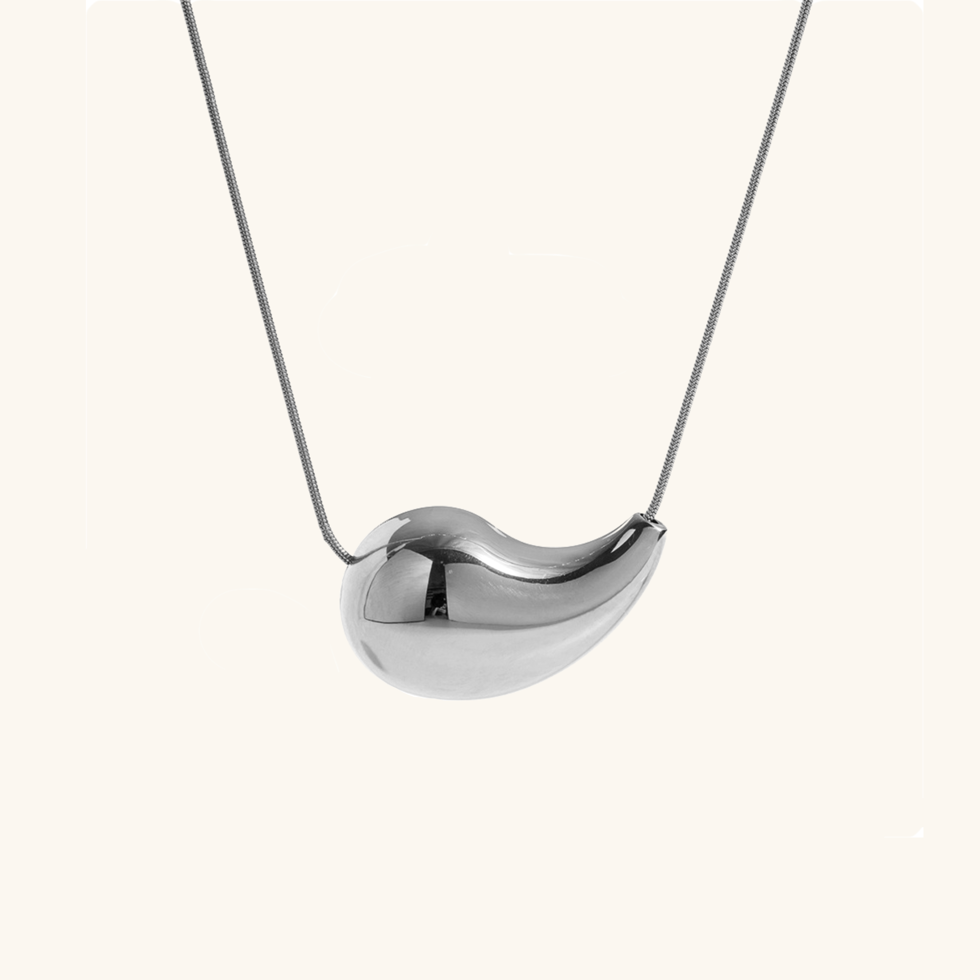 Malia - Sleek Bean Necklace — bringing modern charm to your space. Malia - Sleek Bean Necklace — bringing modern charm to your space.