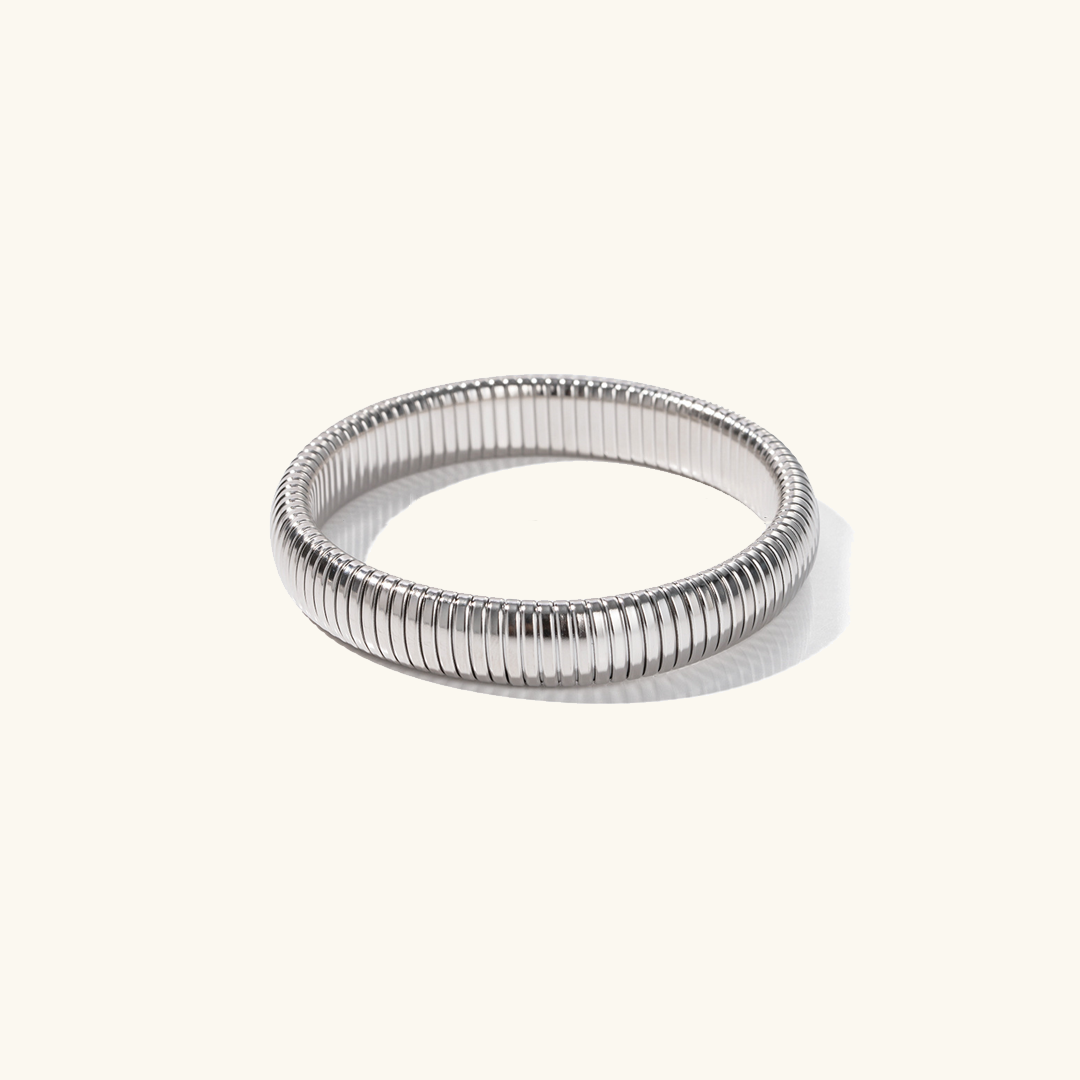Daphne - Coil Bangle — bringing modern charm to your space. Daphne - Coil Bangle — bringing modern charm to your space.