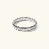 Daphne - Coil Bangle — bringing modern charm to your space. Daphne - Coil Bangle — bringing modern charm to your space.
