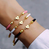 Nora - Adjustable Heart Letter Initial Bracelets Pink — made with care and attention to detail. Nora - Adjustable Heart Letter Initial Bracelets Pink — made with care and attention to detail.