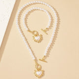Calira - Beaded Heart Pendant Bracelet and Necklace Set Gold White — crafted for everyday quality. Calira - Beaded Heart Pendant Bracelet and Necklace Set Gold White — crafted for everyday quality.