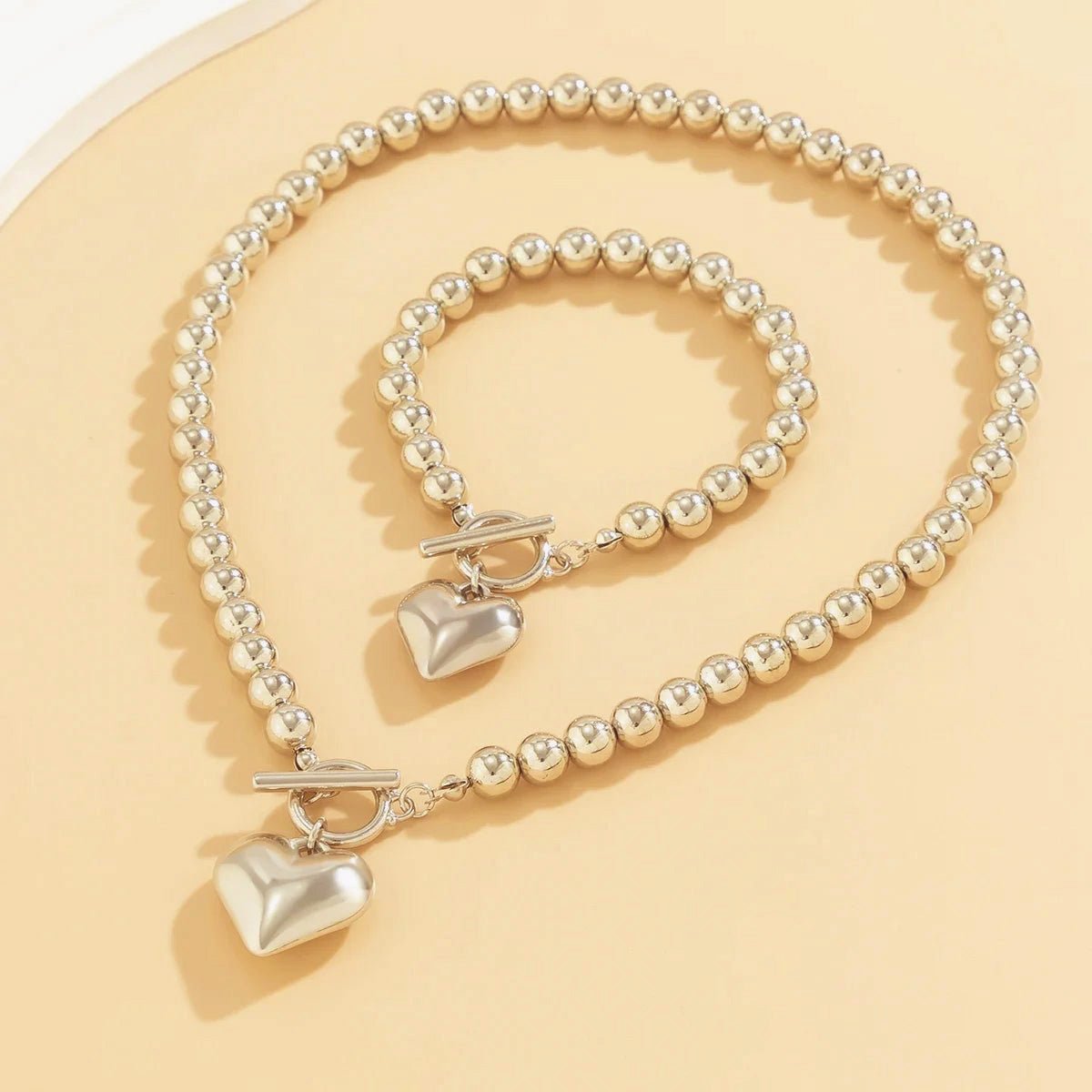 Calira - Beaded Heart Pendant Bracelet and Necklace Set Silver — crafted for everyday quality. Calira - Beaded Heart Pendant Bracelet and Necklace Set Silver — crafted for everyday quality.