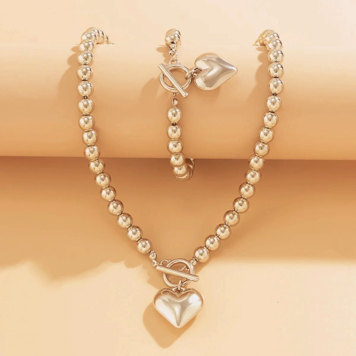 Calira - Beaded Heart Pendant Bracelet and Necklace Set Silver — crafted for everyday quality. Calira - Beaded Heart Pendant Bracelet and Necklace Set Silver — crafted for everyday quality.