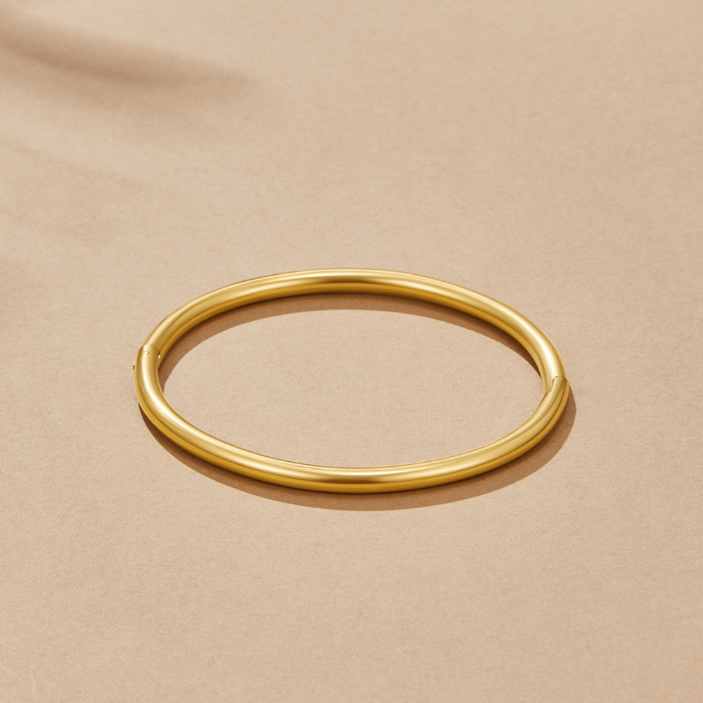 Aisha - Slim Gold Bangle — crafted for everyday quality. Aisha - Slim Gold Bangle — crafted for everyday quality.
