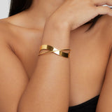 Sloan - Gold Curve Bangle — crafted for everyday quality. Sloan - Gold Curve Bangle — crafted for everyday quality.
