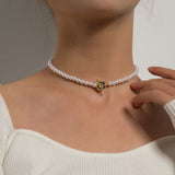 Elora - Flower Clasp Choker Necklace White — made with care and attention to detail. Elora - Flower Clasp Choker Necklace White — made with care and attention to detail.