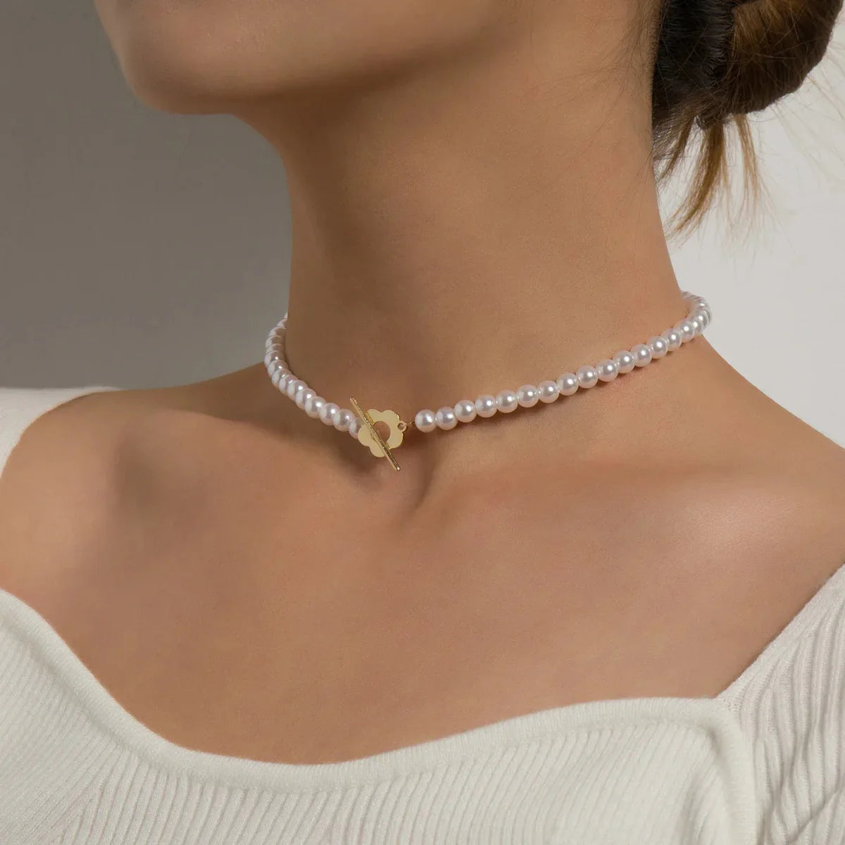 Elora - Flower Clasp Choker Necklace White — made with care and attention to detail. Elora - Flower Clasp Choker Necklace White — made with care and attention to detail.
