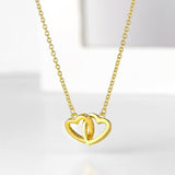Emily - 'To My Daughter' Interlocking Gold Heart Necklace — bringing modern charm to your space. Emily - 'To My Daughter' Interlocking Gold Heart Necklace — bringing modern charm to your space.