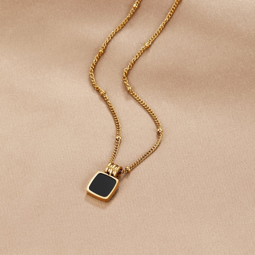 Cora - Black Shell Pendant Necklace — crafted for everyday quality. Cora - Black Shell Pendant Necklace — crafted for everyday quality.