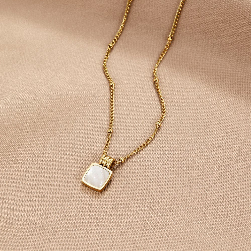 Cora - White Shell Pendant Necklace — crafted for everyday quality. Cora - White Shell Pendant Necklace — crafted for everyday quality.