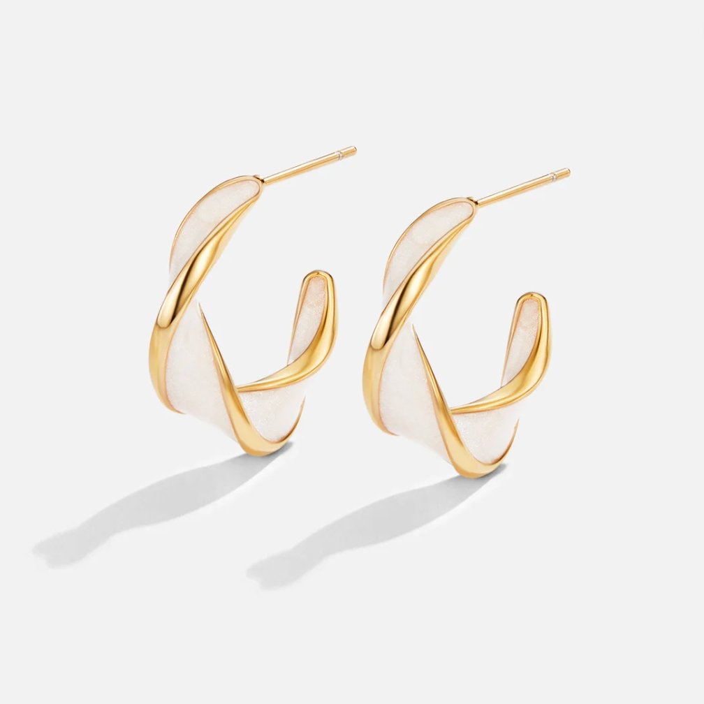 Zoe - Pearl Twist Hoop Earrings — made with care and attention to detail. Zoe - Pearl Twist Hoop Earrings — made with care and attention to detail.