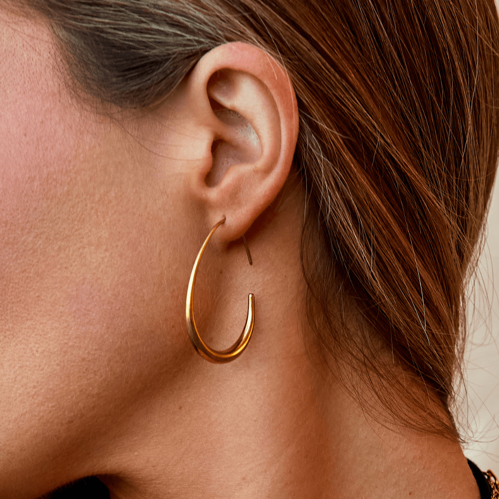 Nica - Gold Hoop Earrings — made with care and attention to detail. Nica - Gold Hoop Earrings — made with care and attention to detail.