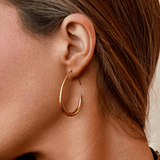 Nica - Gold Hoop Earrings — made with care and attention to detail. Nica - Gold Hoop Earrings — made with care and attention to detail.