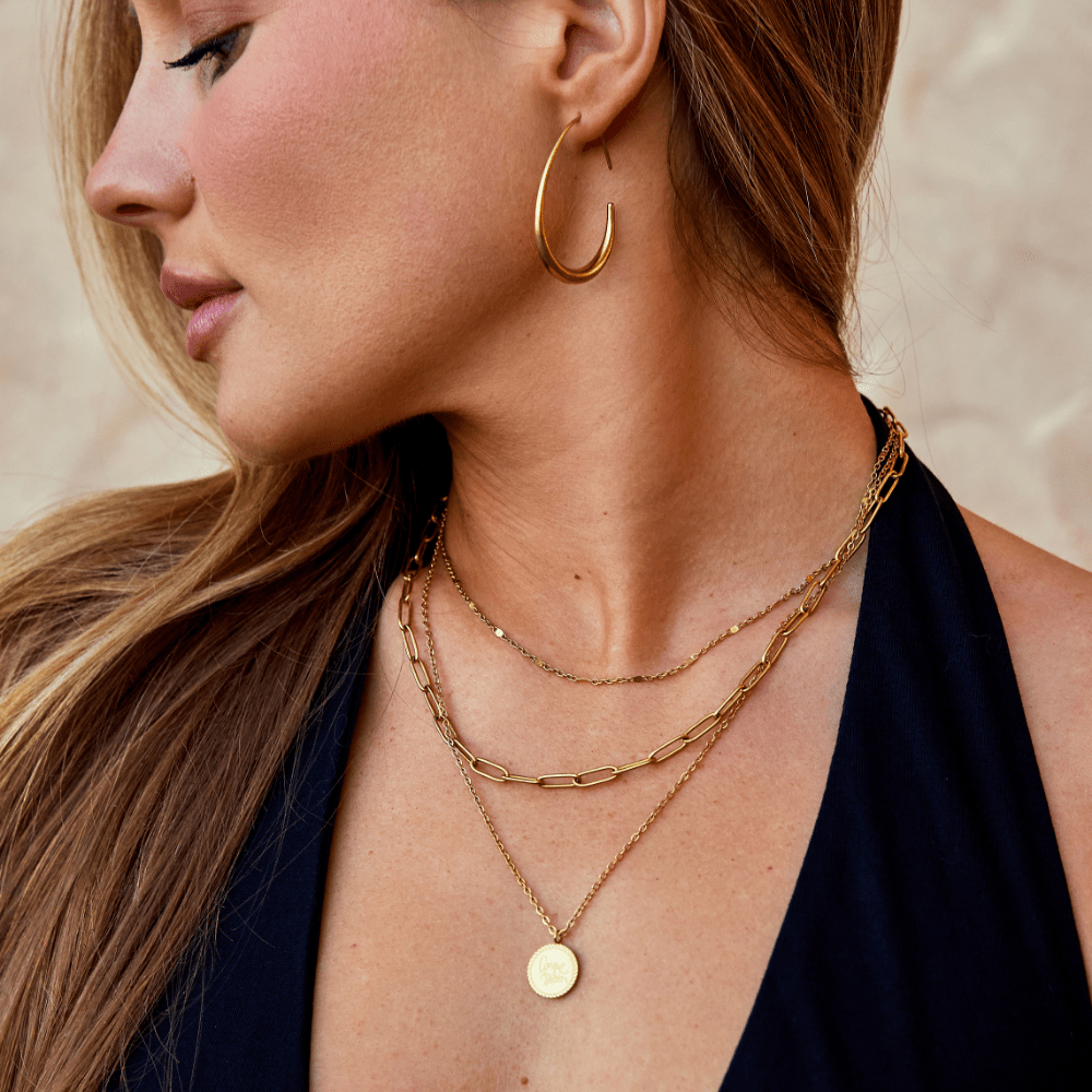 Nica - Gold Hoop Earrings — made with care and attention to detail. Nica - Gold Hoop Earrings — made with care and attention to detail.