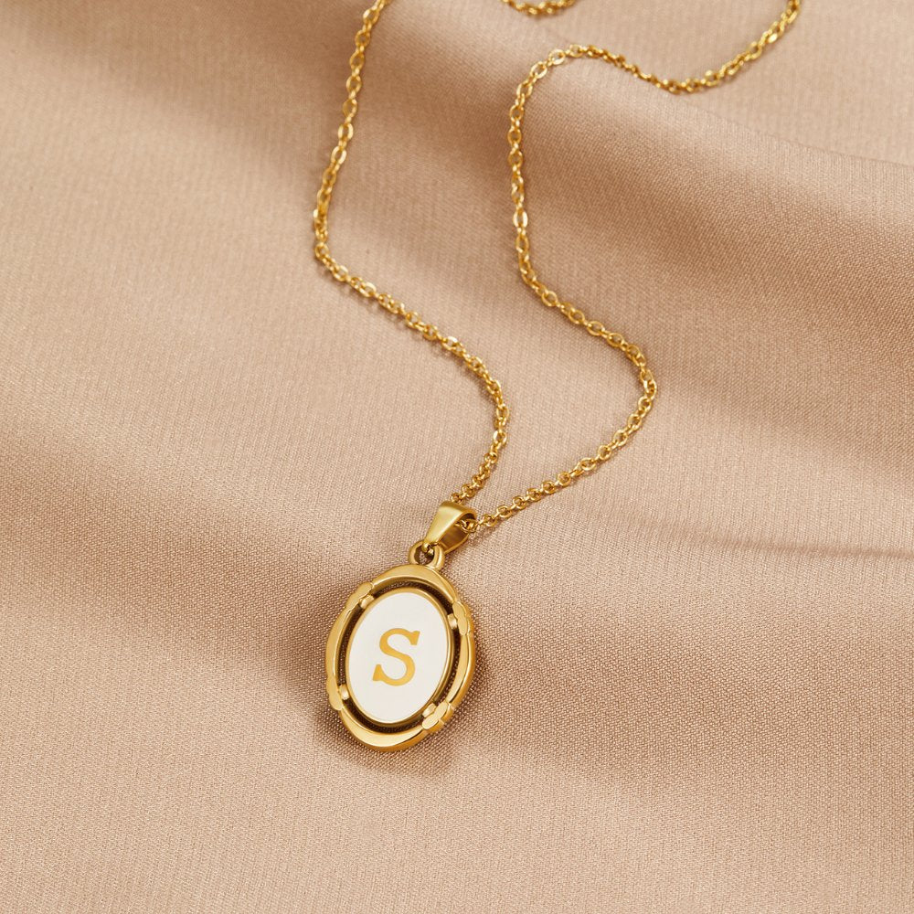 Trinity - Vintage Gold Letter Necklace — made with care and attention to detail. Trinity - Vintage Gold Letter Necklace — made with care and attention to detail.