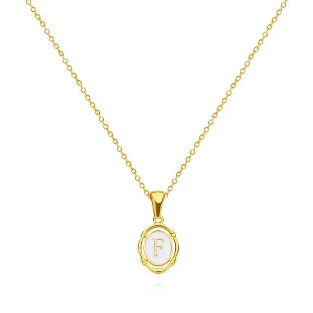 Trinity - Vintage Gold Letter Necklace — made with care and attention to detail. Trinity - Vintage Gold Letter Necklace — made with care and attention to detail.