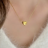 Irene - Gold Heart Necklace — bringing modern charm to your space.