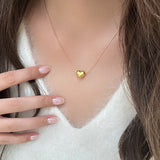 Irene - Gold Heart Necklace — bringing modern charm to your space.