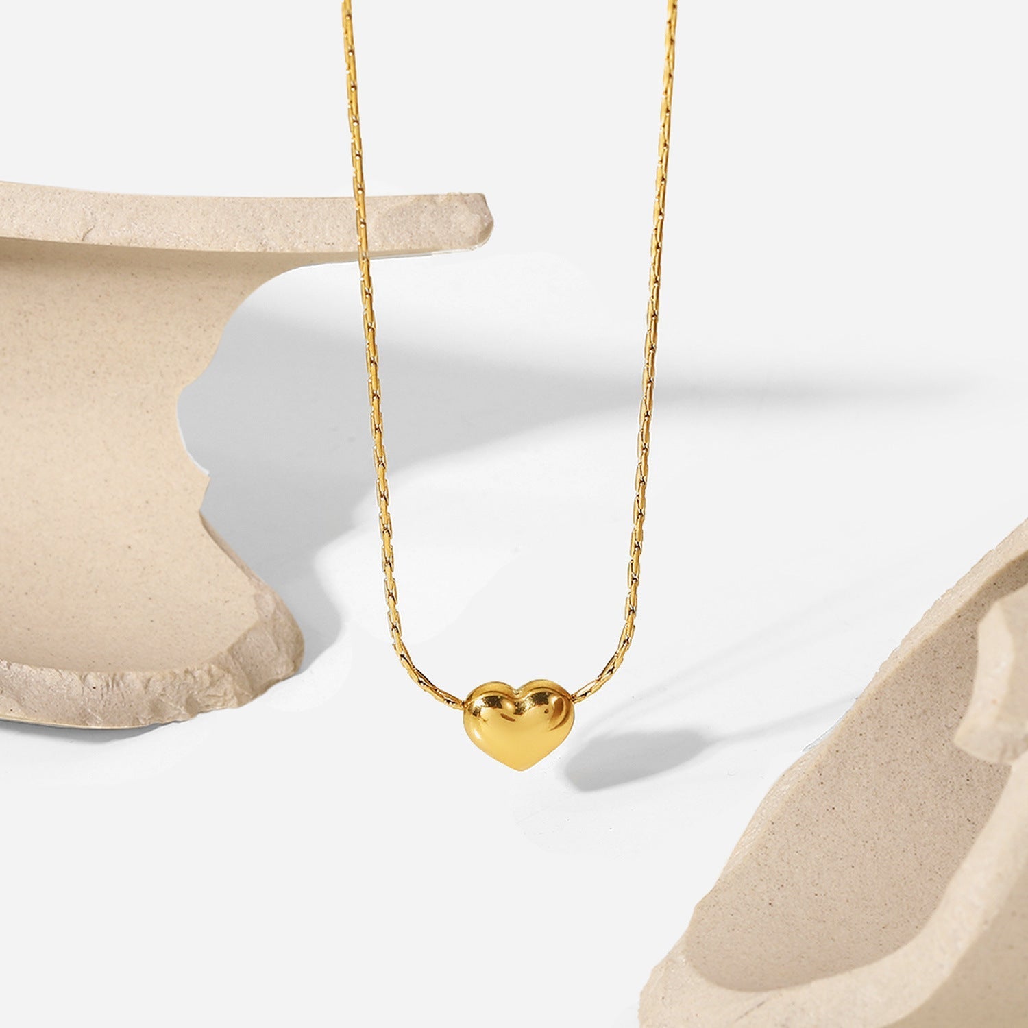 Irene - Gold Heart Necklace — bringing modern charm to your space.