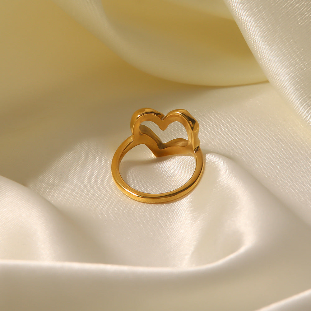 Nalini - Hollow Heart Ring — bringing modern charm to your space.