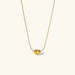 Irene - Gold Heart Necklace — bringing modern charm to your space.