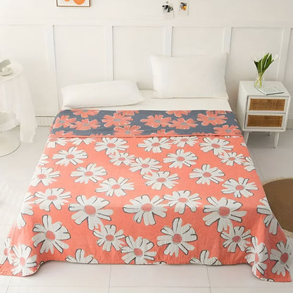Couverture douce en coton à motif marguerites pour une décoration et un confort estivaux à la maison.