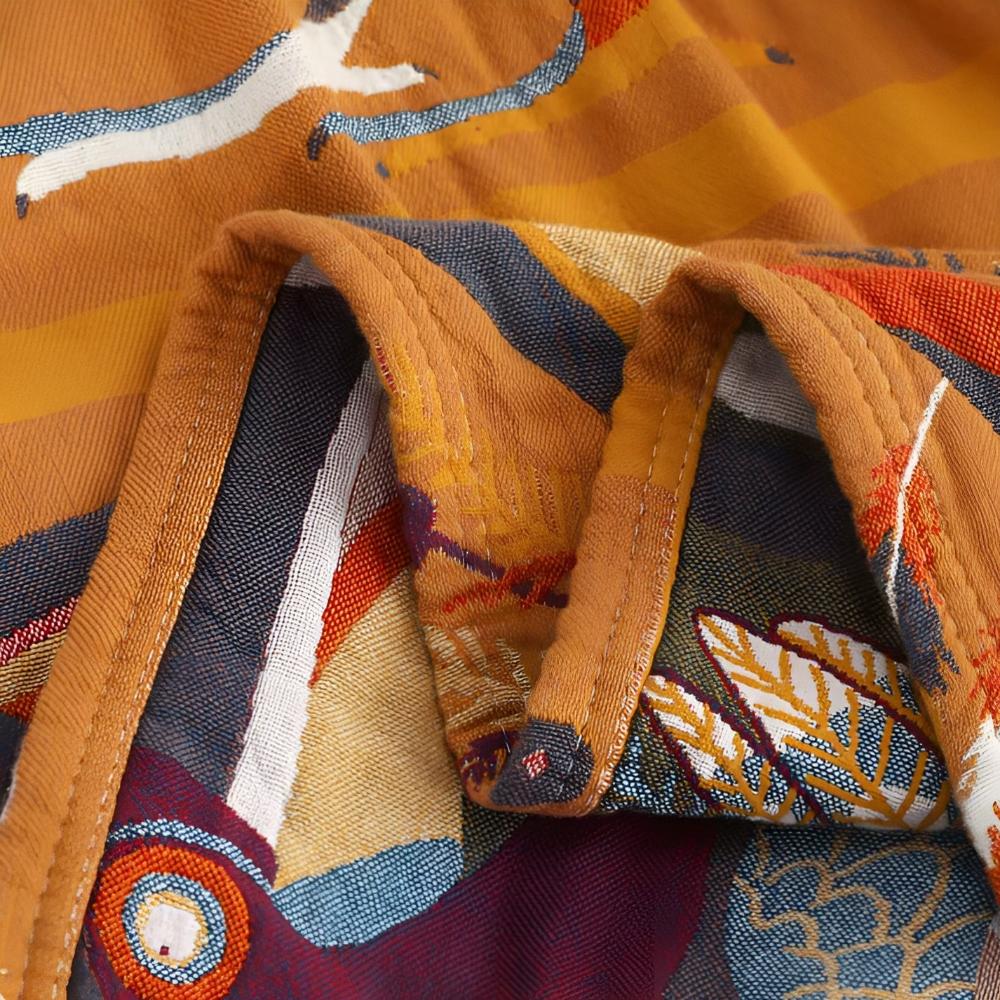 Baumwoll-Wohndecke mit Tukan-Motiv für gemütliches Wohnen
