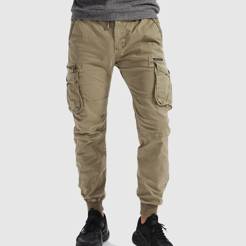 Pantalons cargo pour hommes avec design à plusieurs poches et élastiques au niveau des boutons