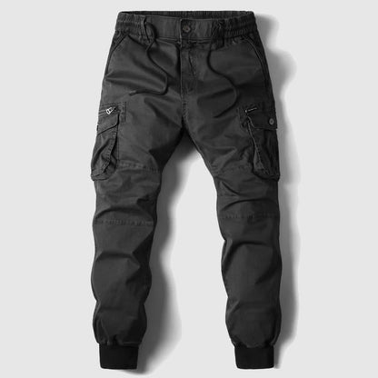 Pantalons cargo pour hommes avec design à plusieurs poches et élastiques au niveau des boutons
